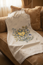 White tank top with floral design on a brown couch