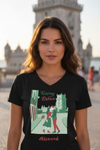 Woman wearing a black t-shirt with 'Kissing Lisbon' design in front of a cityscape.
